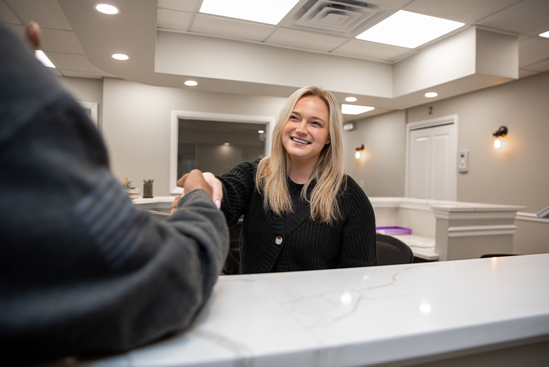 staff member shaking patient hand